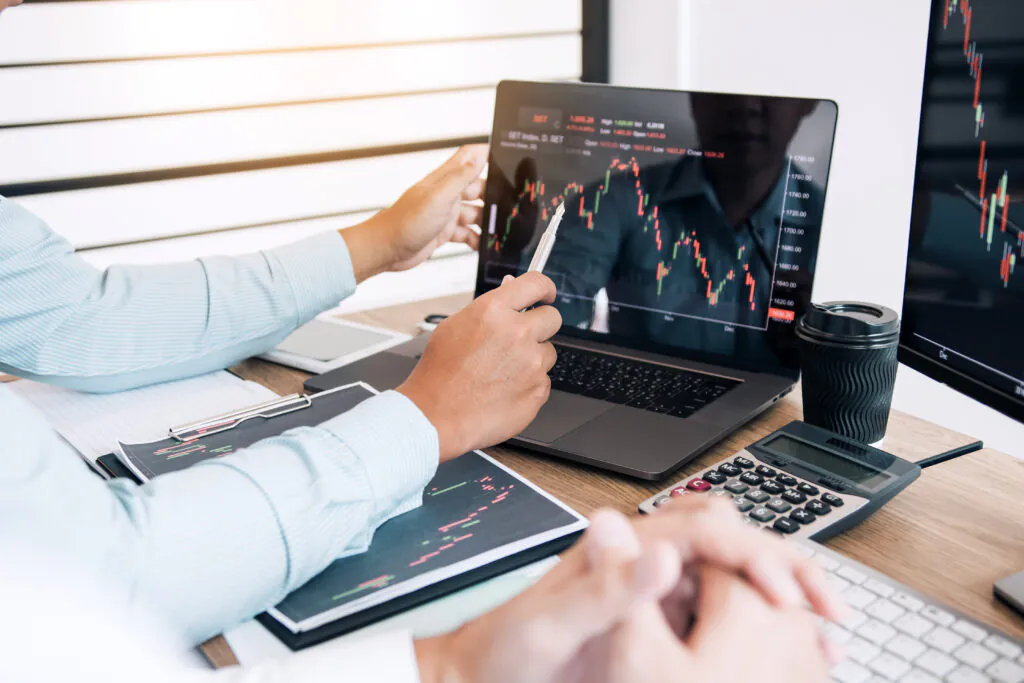 Two partnership investors discussion working together are analyz